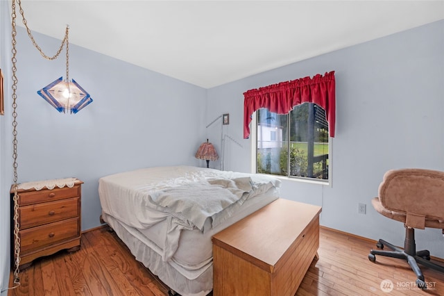 bedroom featuring light wood finished floors