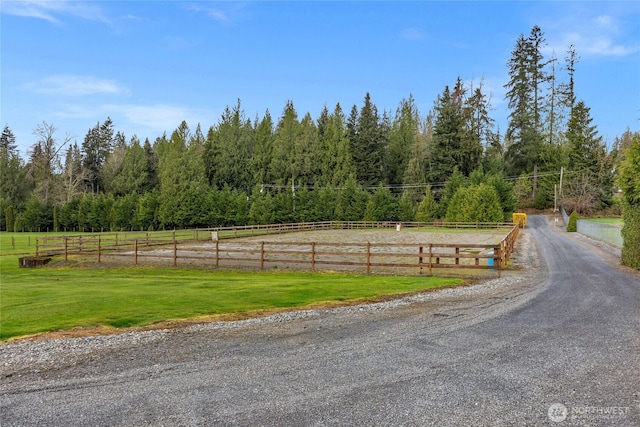 view of road featuring a rural view and an enclosed area