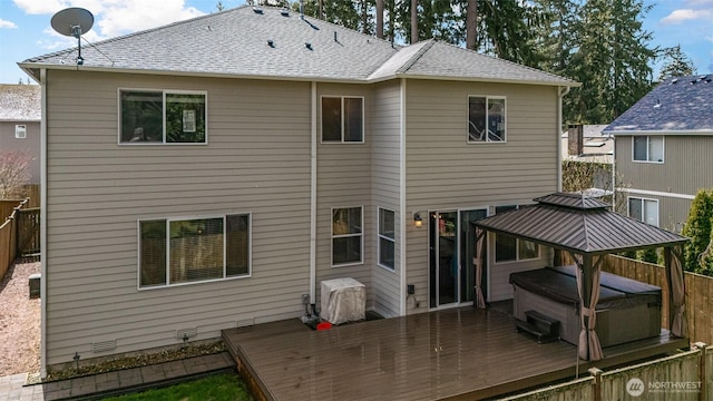 27631 154th Pl SE, Kent, WA 98042 - back of property featuring roof with shingles, fence, a hot tub, and a wooden deck