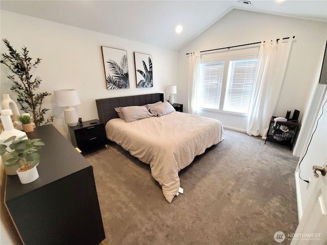 carpeted bedroom with vaulted ceiling