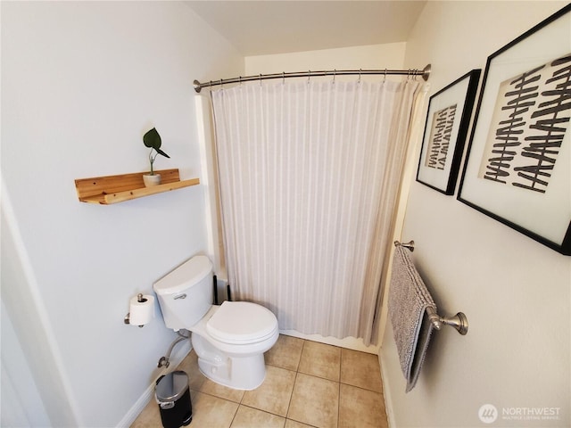 full bath with a shower with curtain, tile patterned floors, and toilet