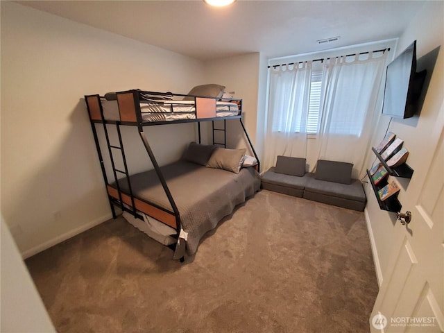 carpeted bedroom with baseboards and visible vents