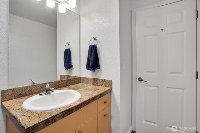 12519 SE 41st Pl Unit B103, Bellevue, WA 98006 - bathroom featuring vanity and a textured wall
