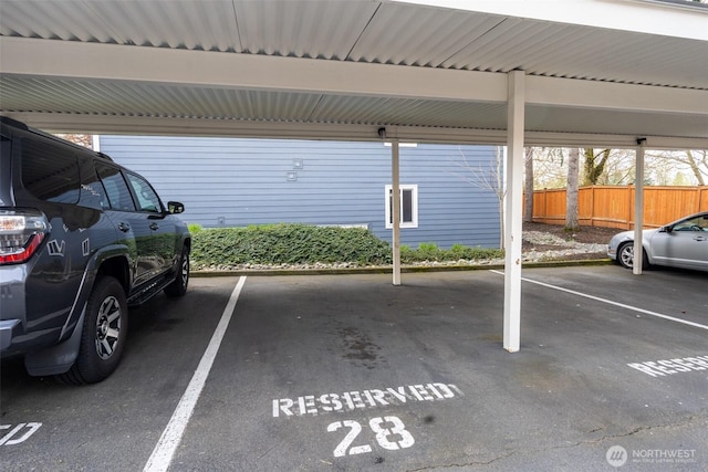 12519 SE 41st Pl Unit B103, Bellevue, WA 98006 - covered parking lot featuring fence