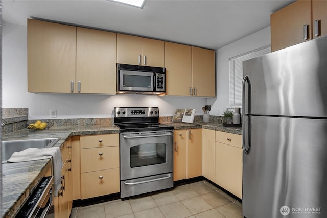 12519 SE 41st Pl Unit B103, Bellevue, WA 98006 - kitchen featuring light brown cabinets, light tile patterned flooring, and appliances with stainless steel finishes