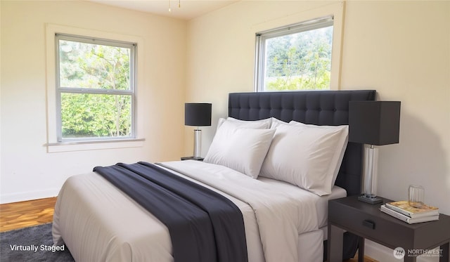 bedroom with wood finished floors