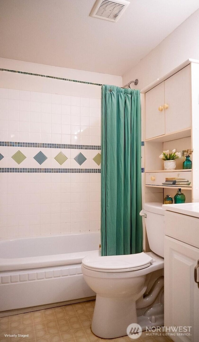 bathroom featuring visible vents, toilet, and shower / bath combo with shower curtain