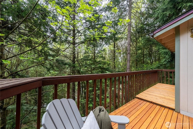 wooden terrace with a forest view