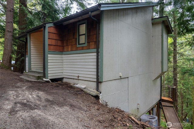 view of side of property featuring central AC unit
