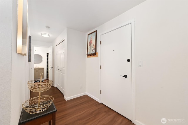 7021 Sand Point Way Unit B319, Seattle, WA 98115 - hallway with dark wood-type flooring and baseboards