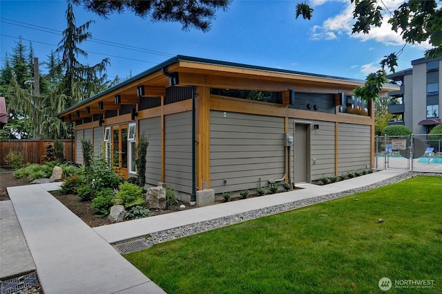 7021 Sand Point Way Unit B319, Seattle, WA 98115 - view of outdoor structure with a community pool