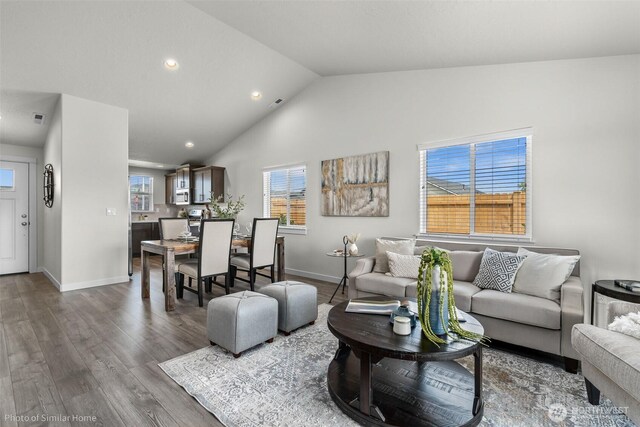 705 Ava St, Walla Walla, WA 99362 - living area with recessed lighting, wood finished floors, lofted ceiling, and baseboards