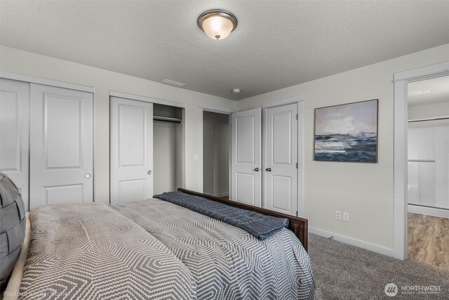 705 Ava St, Walla Walla, WA 99362 - bedroom featuring multiple closets, baseboards, a textured ceiling, and carpet