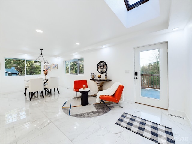 interior space featuring recessed lighting, baseboards, marble finish floor, a skylight, and visible vents