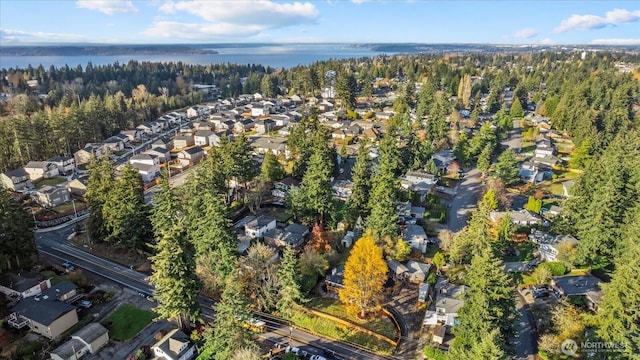 drone / aerial view featuring a residential view and a water view