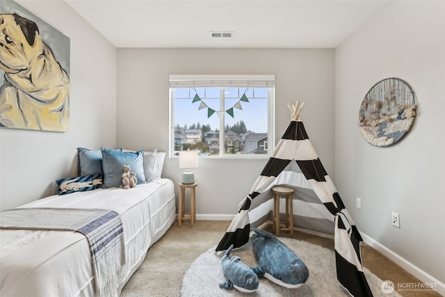 bedroom featuring baseboards, visible vents, and carpet
