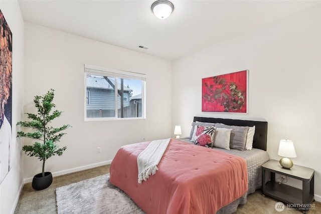 bedroom with baseboards, carpet flooring, and visible vents