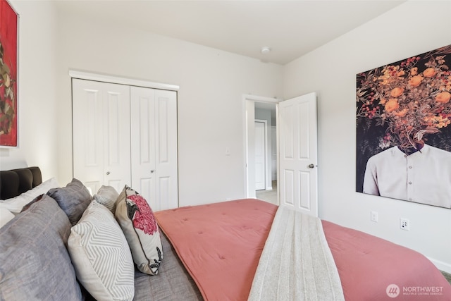 bedroom featuring a closet and carpet flooring