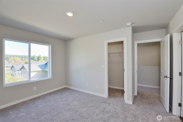 1208 E 53rd St, Tacoma, WA 98404 - unfurnished bedroom featuring baseboards, carpet flooring, and a spacious closet