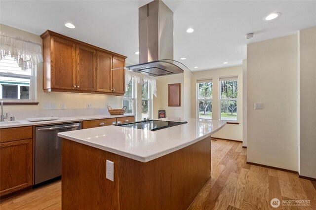 kitchen with stainless steel dishwasher, a center island, a sink, island exhaust hood, and black electric stovetop