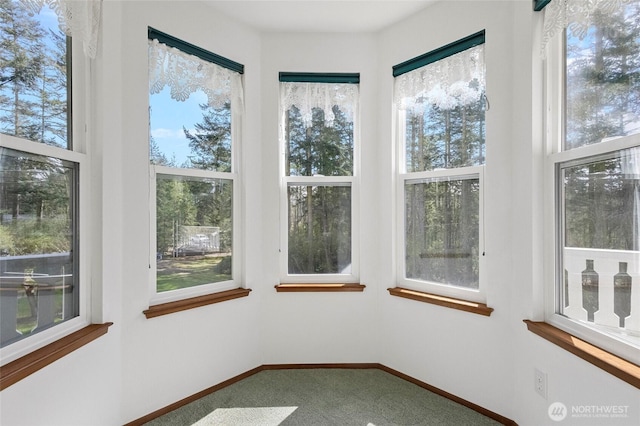 unfurnished sunroom featuring a healthy amount of sunlight