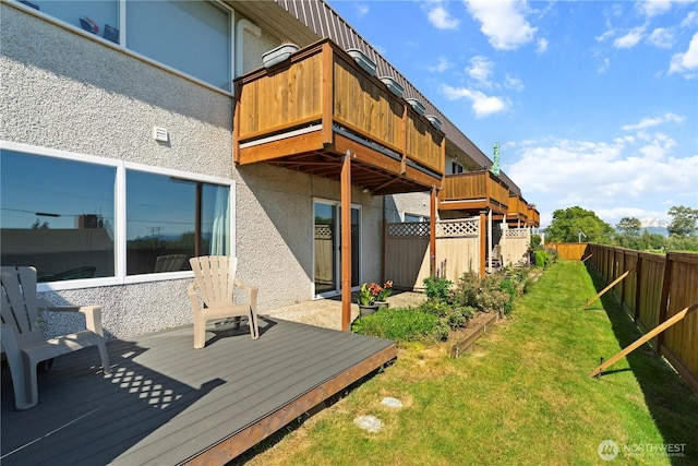 5807 Hendrickson Unit 106, Ferndale, WA 98248 - rear view of property featuring a wooden deck and stucco siding