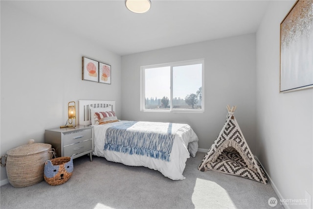 13815 Brookdale Ln E Unit 107, Tacoma, WA 98445 - bedroom featuring baseboards and carpet