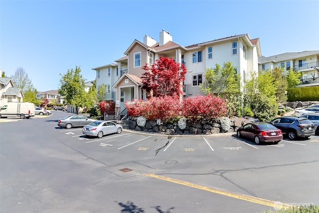 15026 40th Ave W Unit 7-203, Lynnwood, WA 98087 - uncovered parking lot featuring a residential view