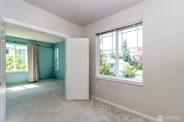 15026 40th Ave W Unit 7-203, Lynnwood, WA 98087 - unfurnished bedroom with baseboards and carpet floors