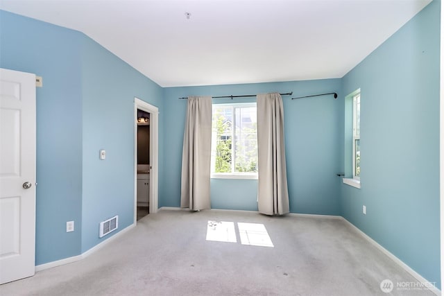 15026 40th Ave W Unit 7-203, Lynnwood, WA 98087 - unfurnished bedroom featuring baseboards, visible vents, and carpet