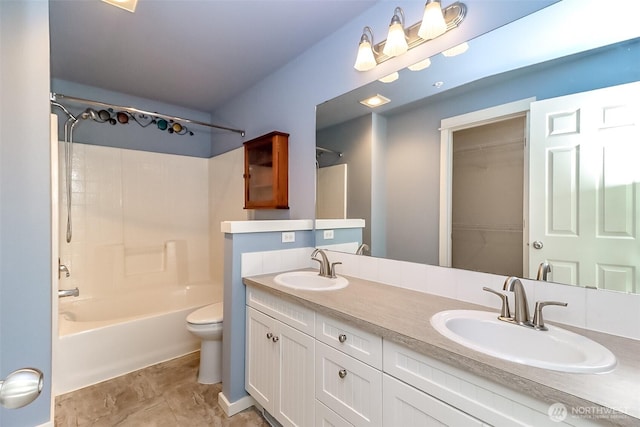 15026 40th Ave W Unit 7-203, Lynnwood, WA 98087 - full bathroom with double vanity, toilet,  shower combination, and a sink