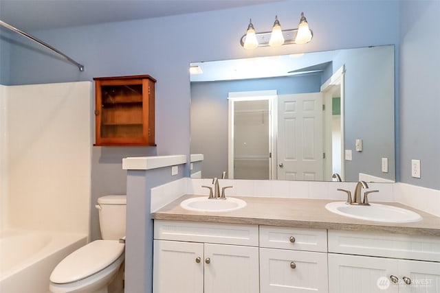 15026 40th Ave W Unit 7-203, Lynnwood, WA 98087 - bathroom with toilet, double vanity, a sink, and shower / bath combination