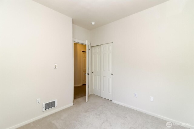 15026 40th Ave W Unit 7-203, Lynnwood, WA 98087 - spare room featuring baseboards, visible vents, and light carpet