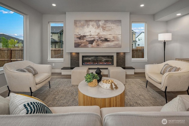 1515 141st St E Unit 72, Tacoma, WA 98445 - living room with wood finished floors, baseboards, recessed lighting, and a glass covered fireplace