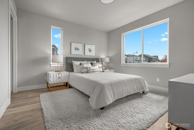 1515 141st St E Unit 72, Tacoma, WA 98445 - bedroom featuring baseboards and wood finished floors
