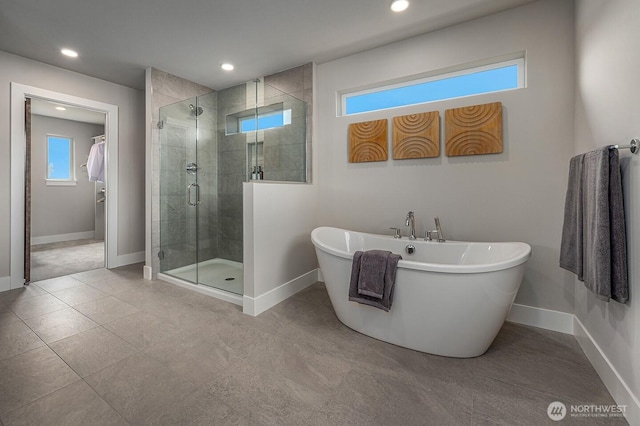 1515 141st St E Unit 72, Tacoma, WA 98445 - bathroom featuring a stall shower, baseboards, a freestanding tub, recessed lighting, and tile patterned floors