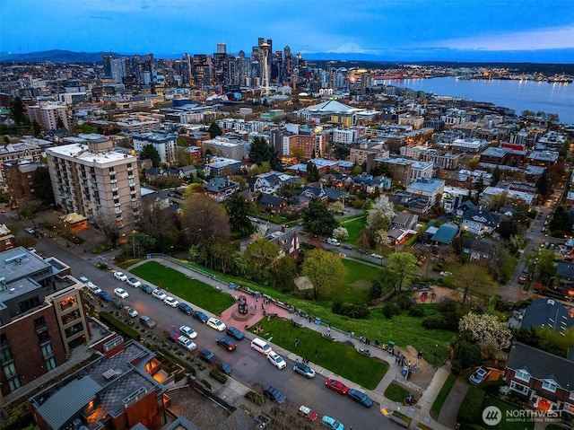 bird's eye view featuring a water view and a view of city