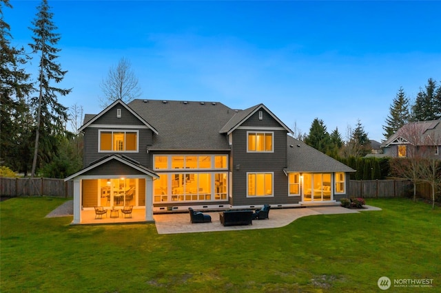 rear view of property with a patio area, a fenced backyard, and a yard