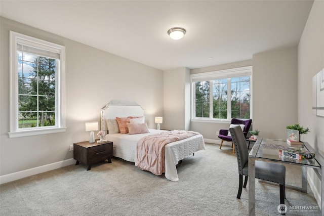 bedroom with carpet flooring, baseboards, and multiple windows