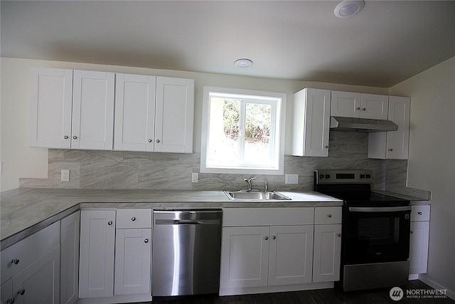kitchen featuring light countertops, under cabinet range hood, a sink, white cabinets, and appliances with stainless steel finishes
