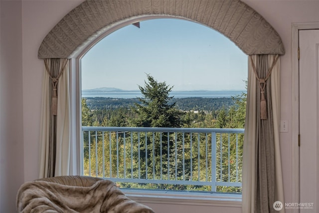 balcony featuring a view of trees