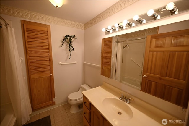 full bathroom with tile patterned floors, toilet, vanity, and shower / bath combo with shower curtain