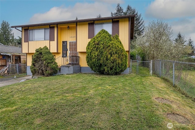 1023 S 88th St, Tacoma, WA 98444 - bi-level home with a front yard, fence, and a gate