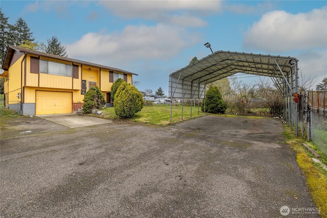 1023 S 88th St, Tacoma, WA 98444 - exterior space featuring a detached carport, fence, and aphalt driveway