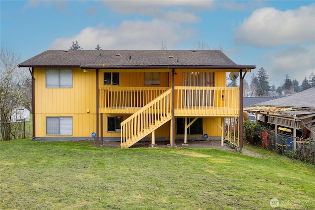 1023 S 88th St, Tacoma, WA 98444 - rear view of house with a yard, a wooden deck, fence, and stairs