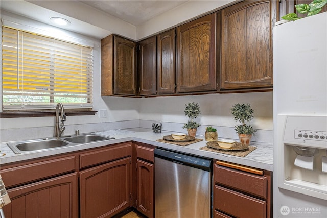 1023 S 88th St, Tacoma, WA 98444 - kitchen featuring stainless steel dishwasher, light countertops, a sink, and white fridge with ice dispenser