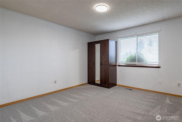 1023 S 88th St, Tacoma, WA 98444 - carpeted empty room featuring visible vents, baseboards, and a textured ceiling