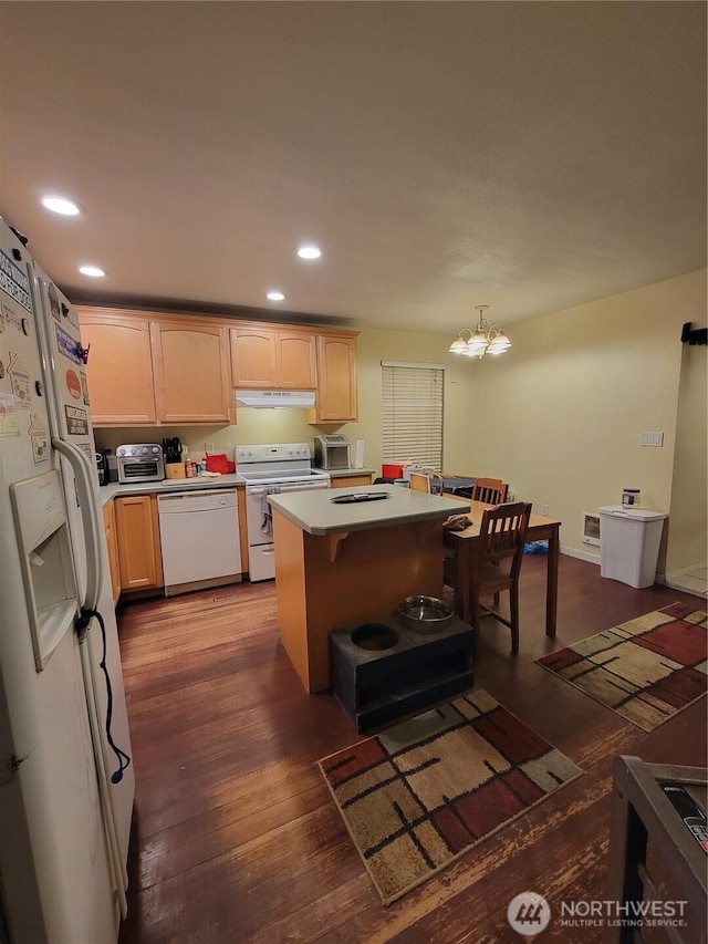 kitchen featuring recessed lighting, white appliances, light brown cabinetry, and dark wood finished floors