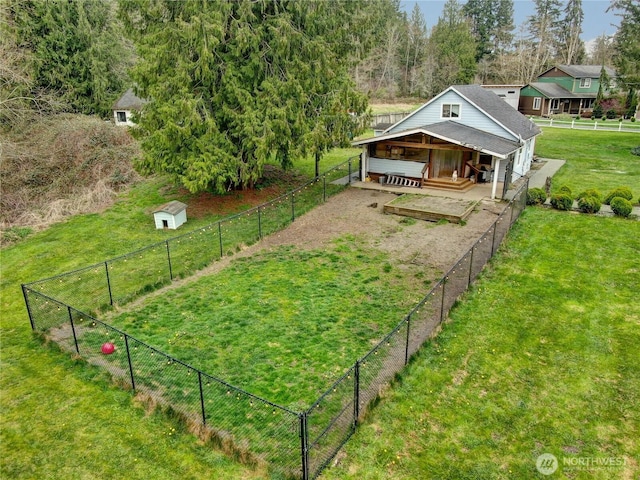view of yard with an outbuilding and driveway