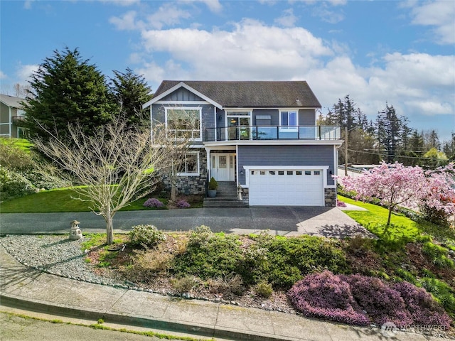 660 Parkside Pl, Blaine, WA 98230 - view of front of home featuring driveway, a balcony, stone siding, and an attached garage